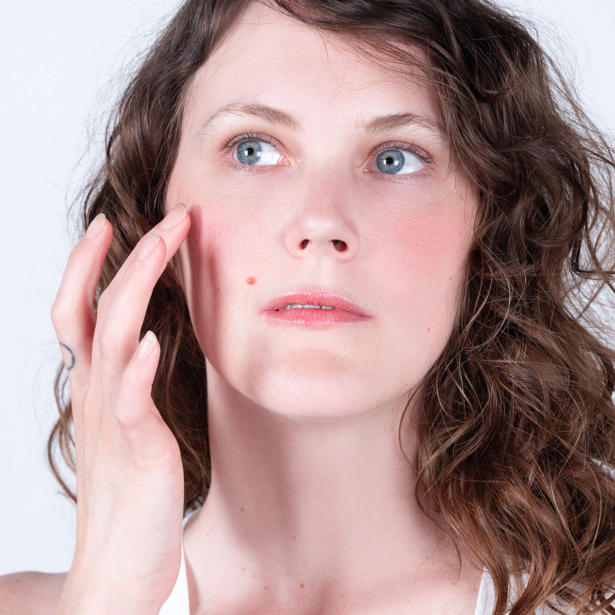 Steph applying all natural lip & cheek tint to her rosy cheeks.