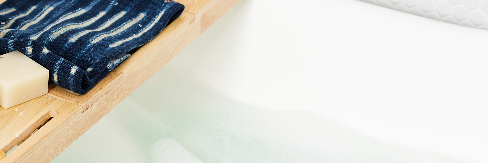 A sudsy bath with a bar of all natural vegan solid shampoo.