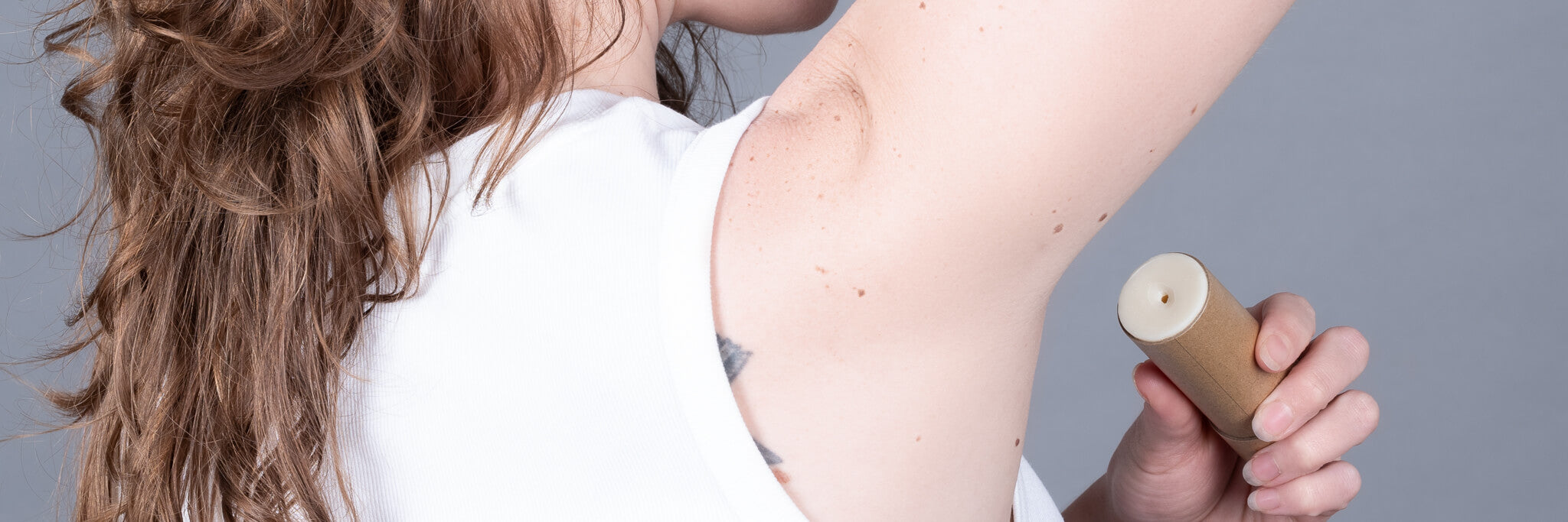 Steph applying all natural plastic free deodorant.