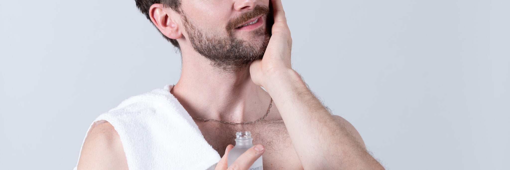 John splashing all natural vegan after shave tonic on his face.