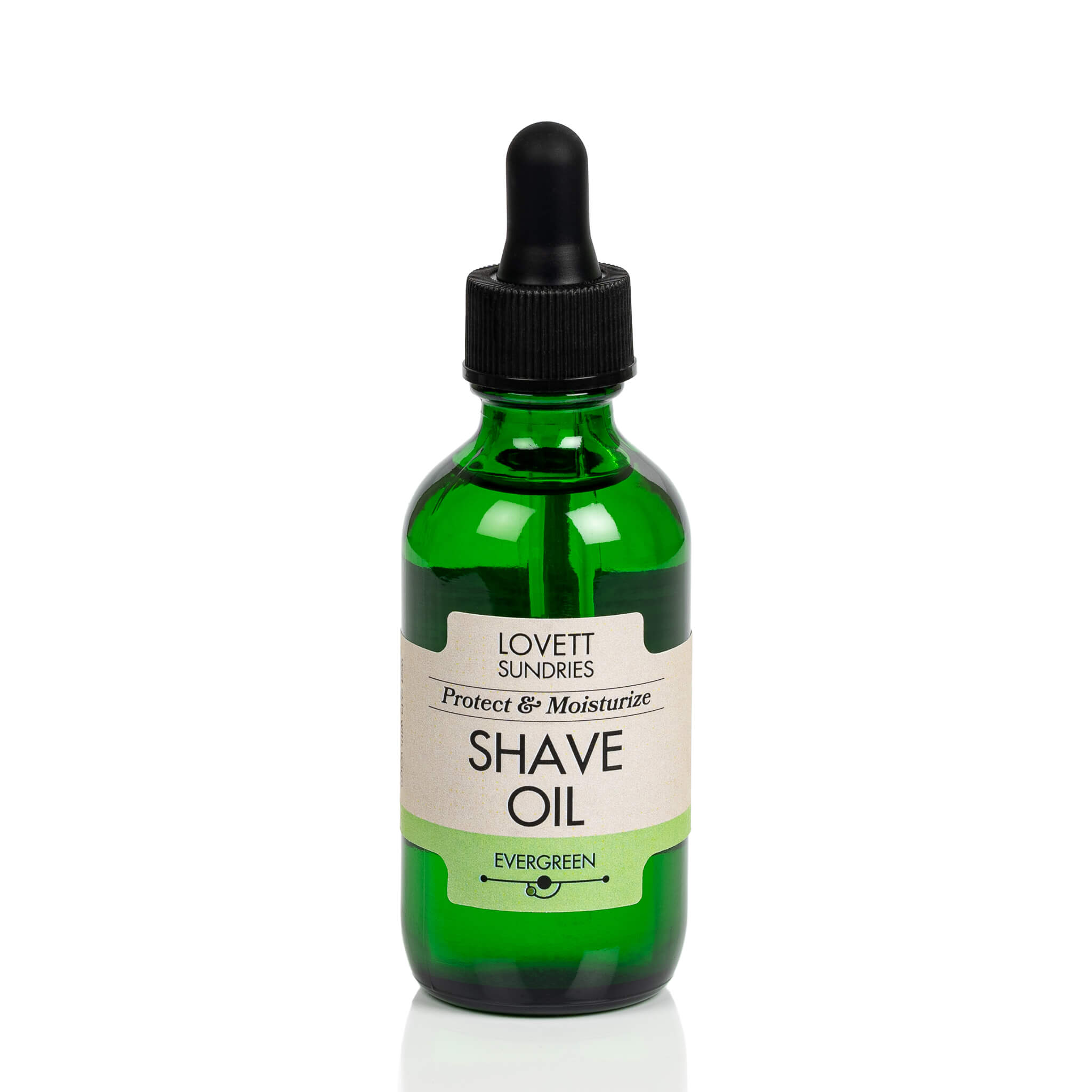 All natural moisturizing and protective evergreen scented shave oil in a green glass bottle with a dropper.