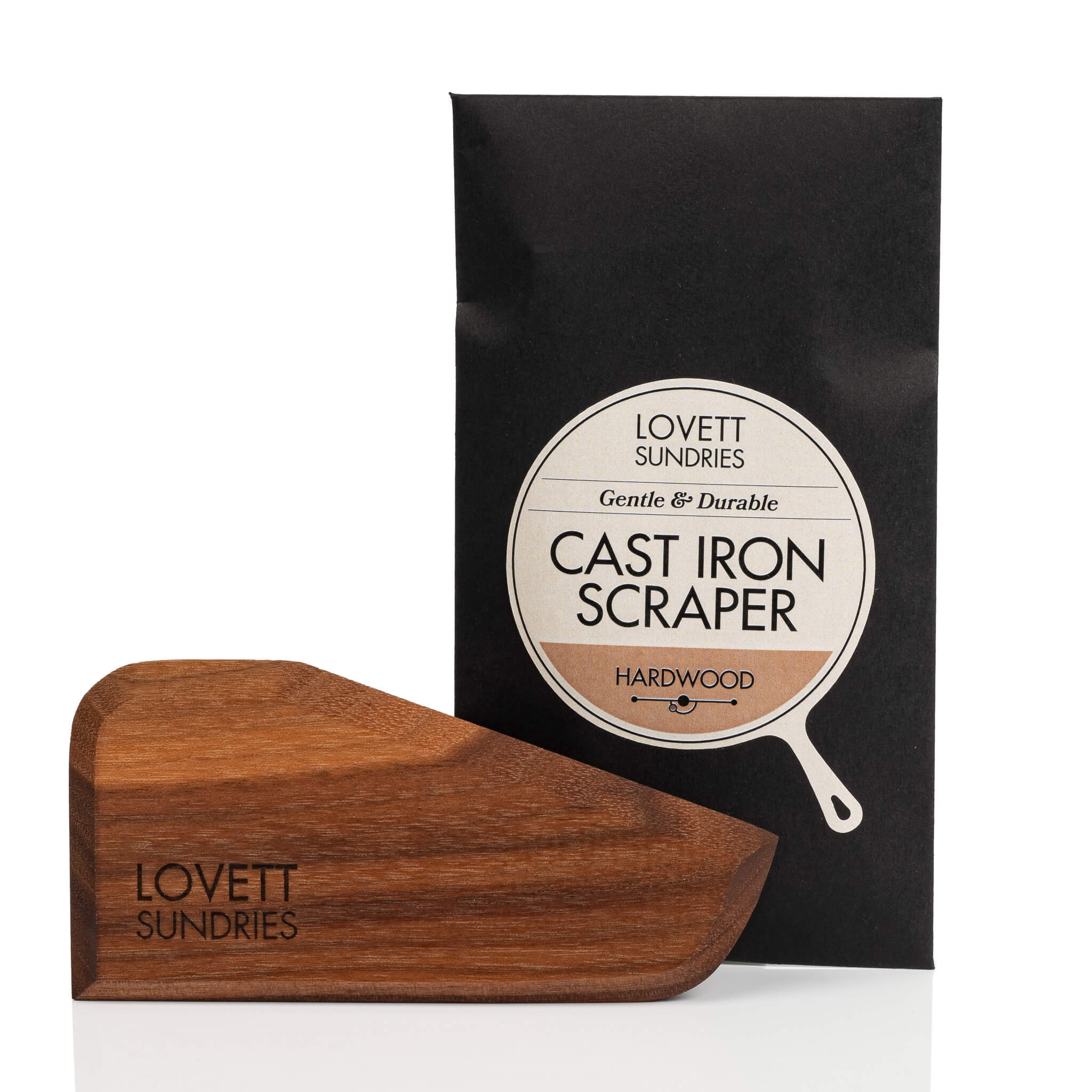 All natural hardwood scraper for cleaning cast iron cookware and envelope with pan shaped label.