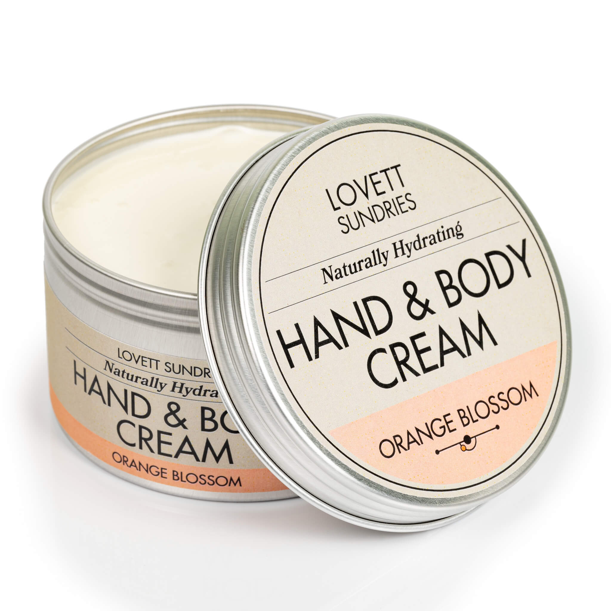 Open tin of creamy all natural hydrating orange blossom scented hand and body cream.