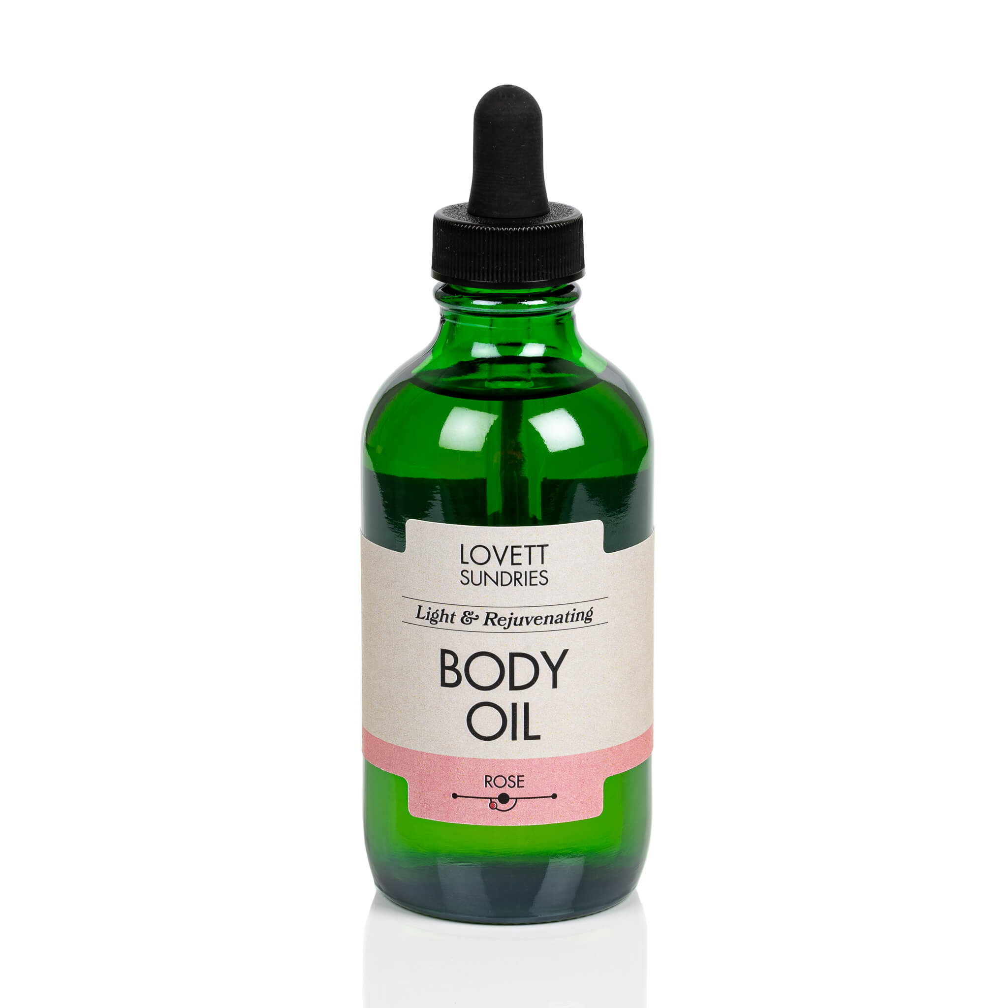 Lovett Sundries organic body oil in a green bottle with dropper.
