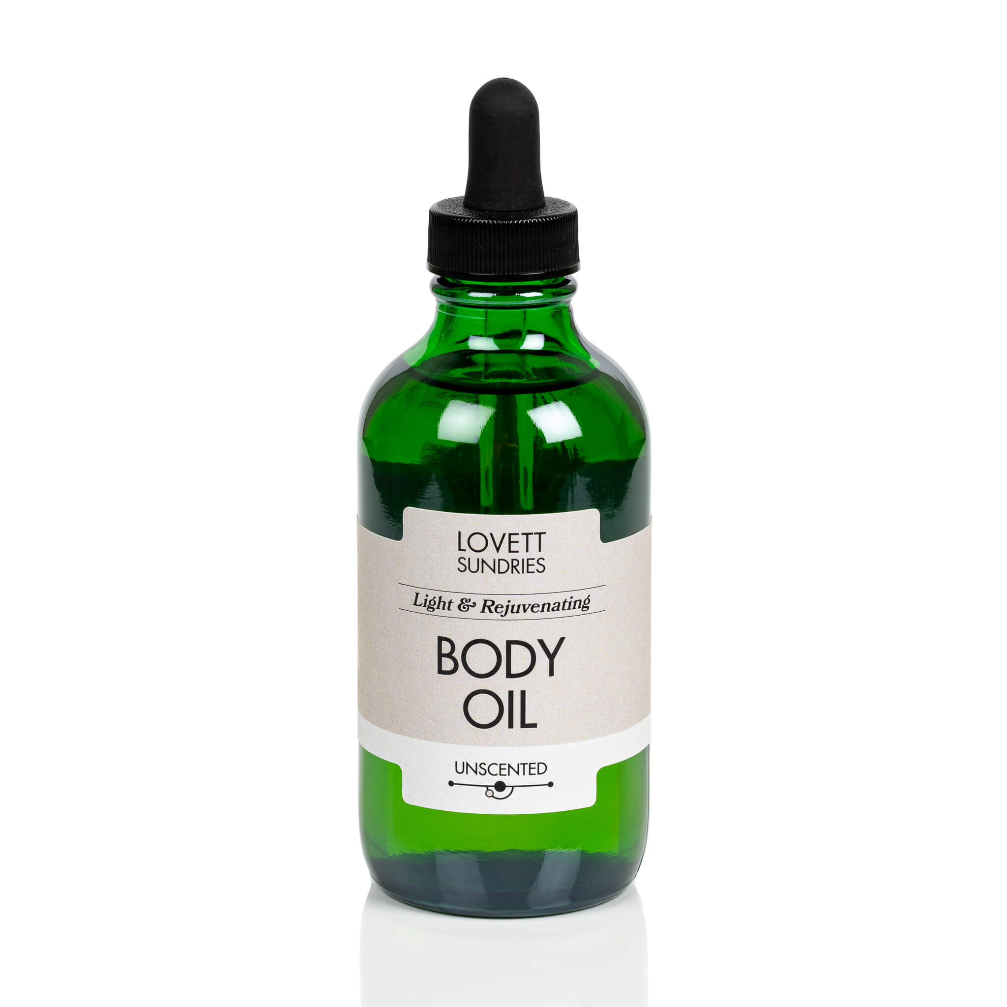 Green bottle of Lovett Sundries Organic Body Oil on a white background.