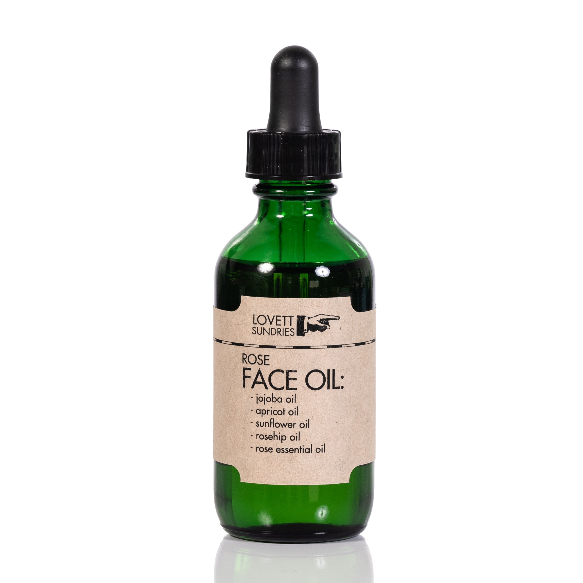 Face Oil in glass bottle with kraft paper label and rubber topped glass vial application dropper.