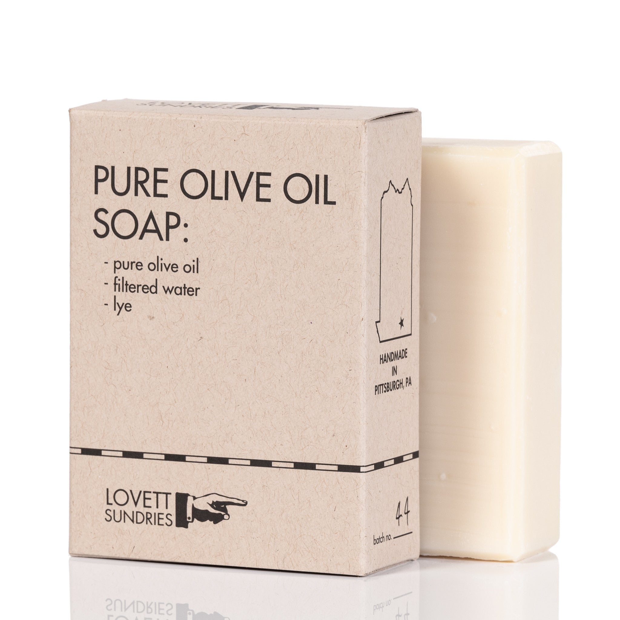 Pure olive oil soap bar in a biodegradable paper container.