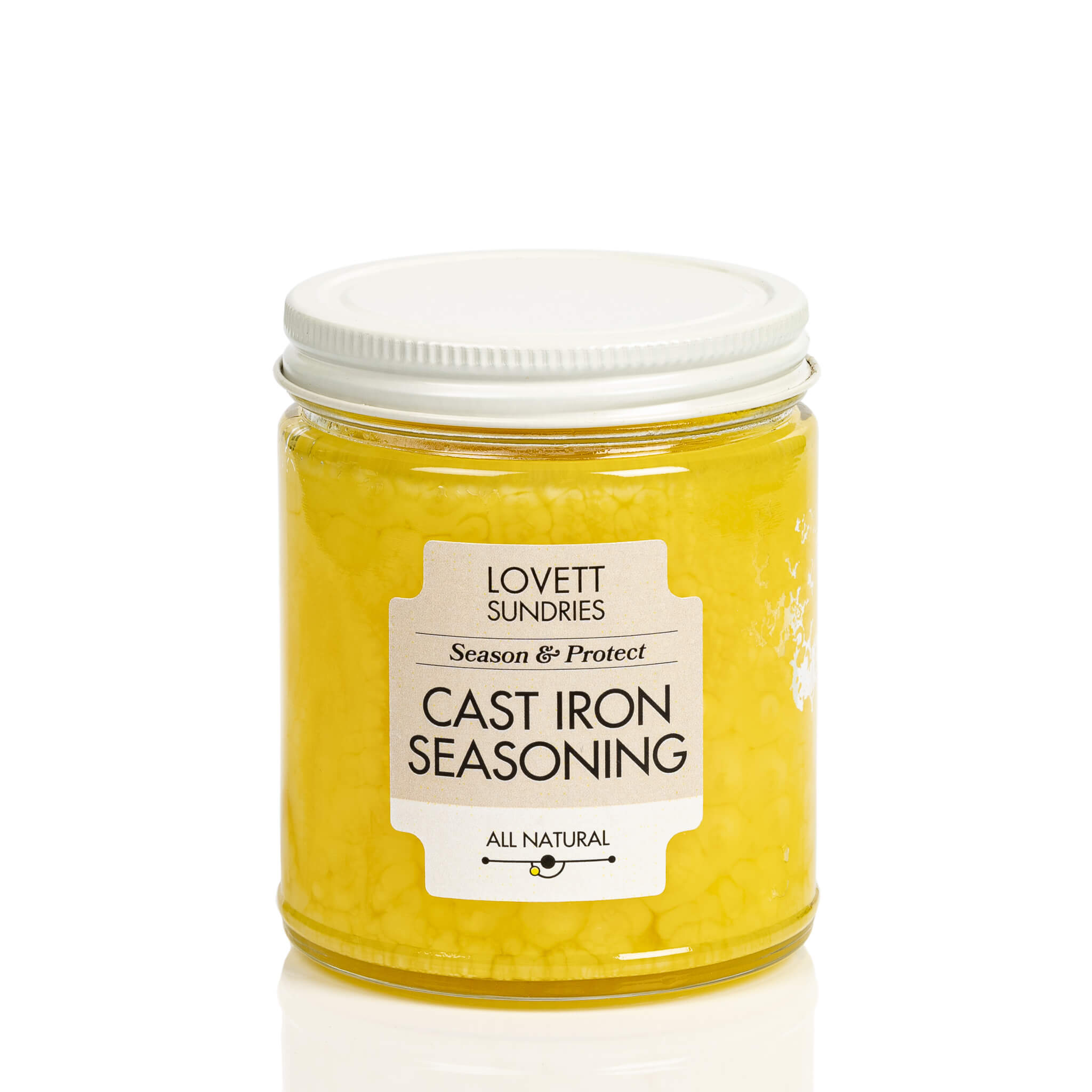 All natural cast iron seasoning oils for seasoning and protecting cast iron cookware in a glass jar.