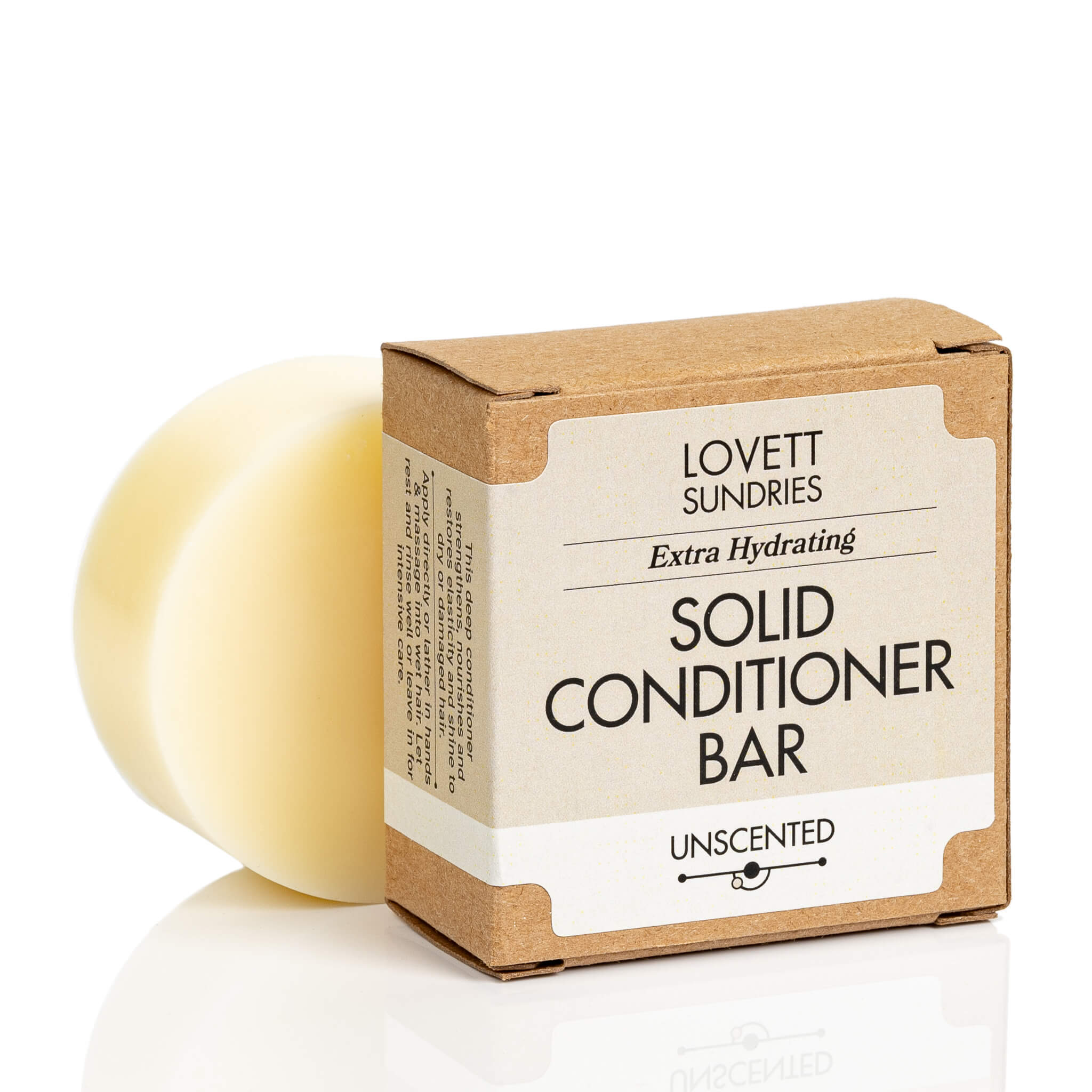 Unscented all natural extra hydrating solid conditioner bar in a recyclable paper box. 