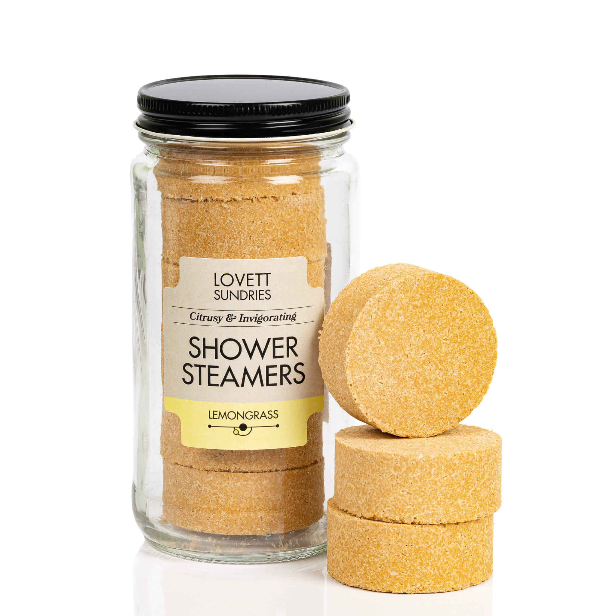 Recyclable glass jar filled with 6 lemongrass scented all natural shower steamers.