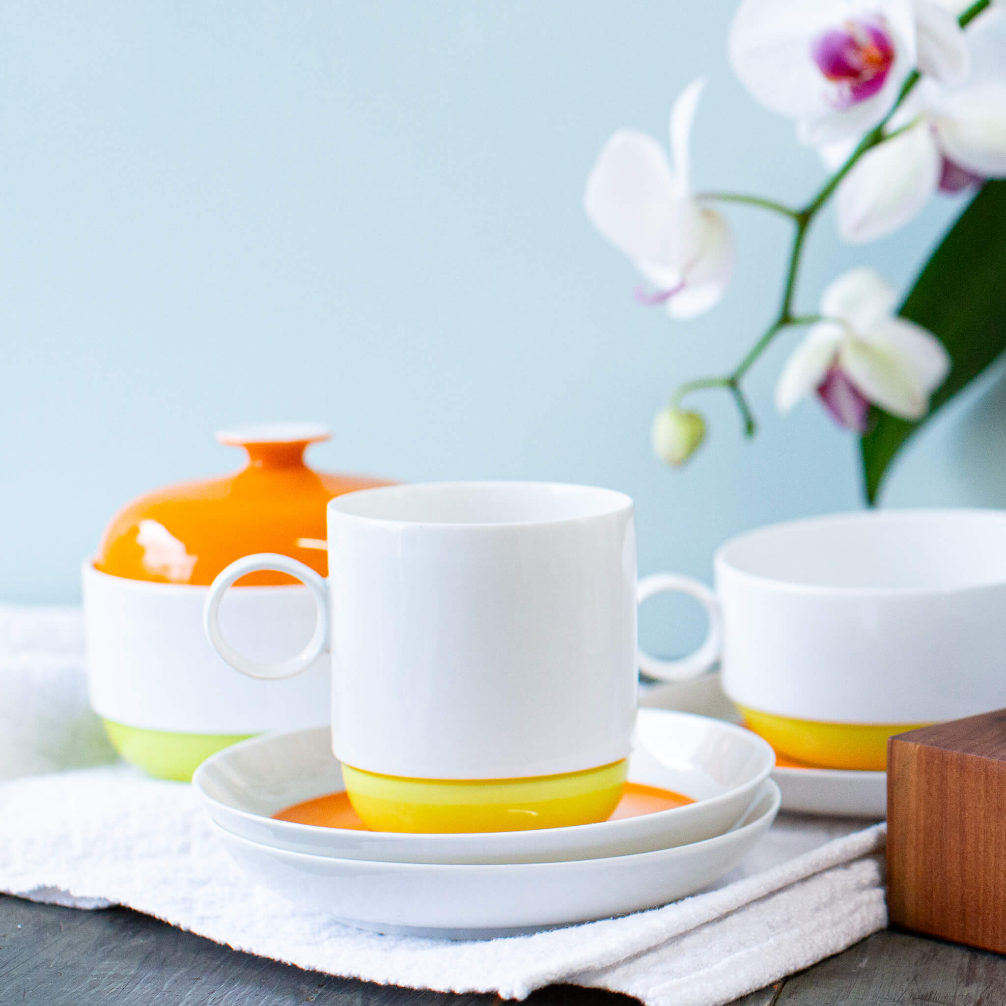 Stack of beautiful sparkling clean mid century modern dishes