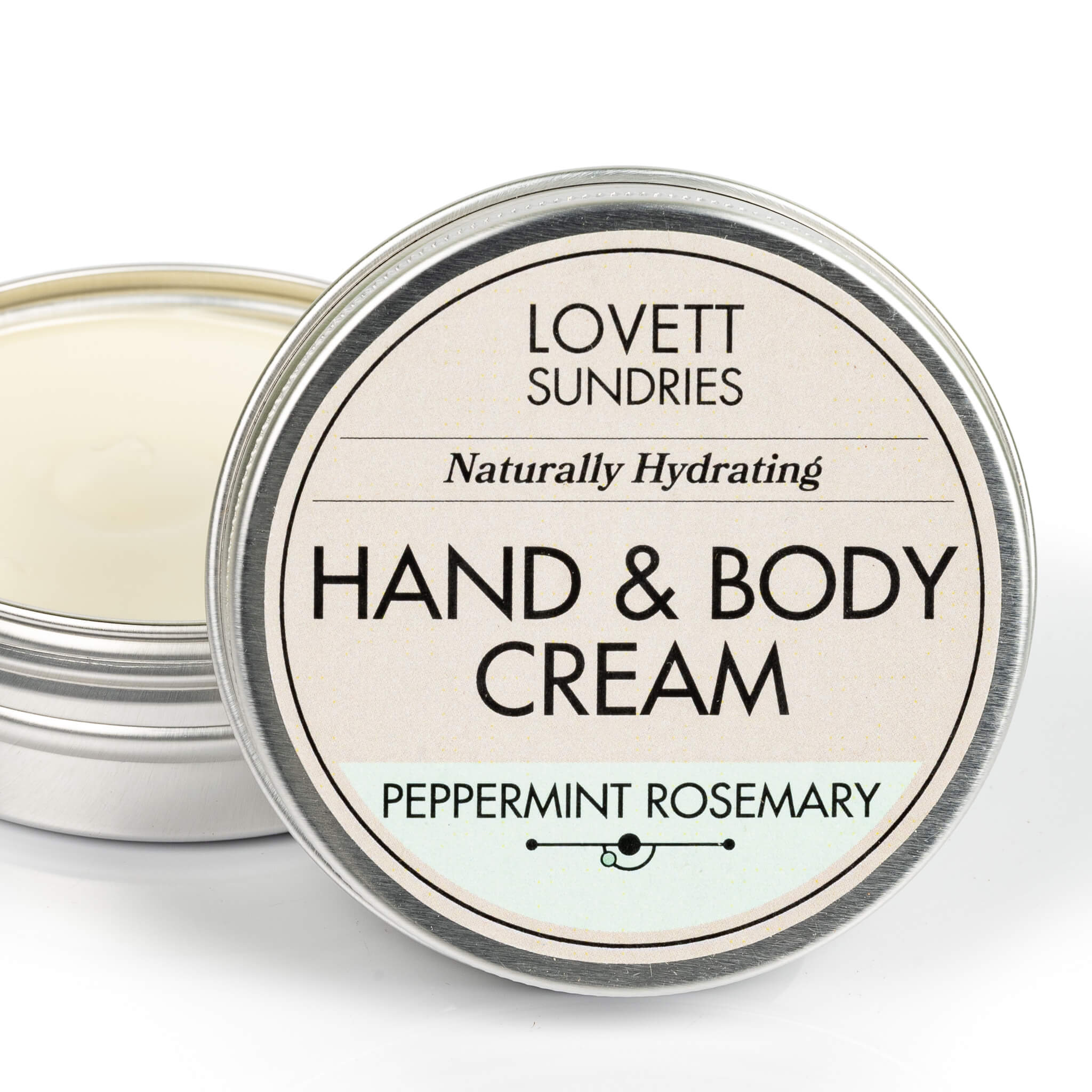 Open tin of creamy all natural hydrating peppermint rosemary scented travel hand and body cream. 