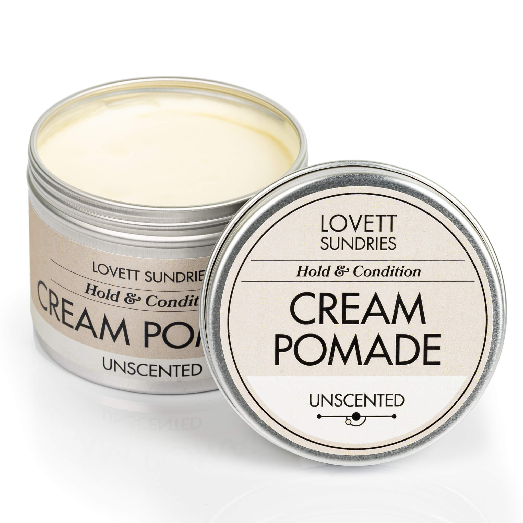 Metal tin of all natural unscented cream pomade for conditioning and styling hair. 