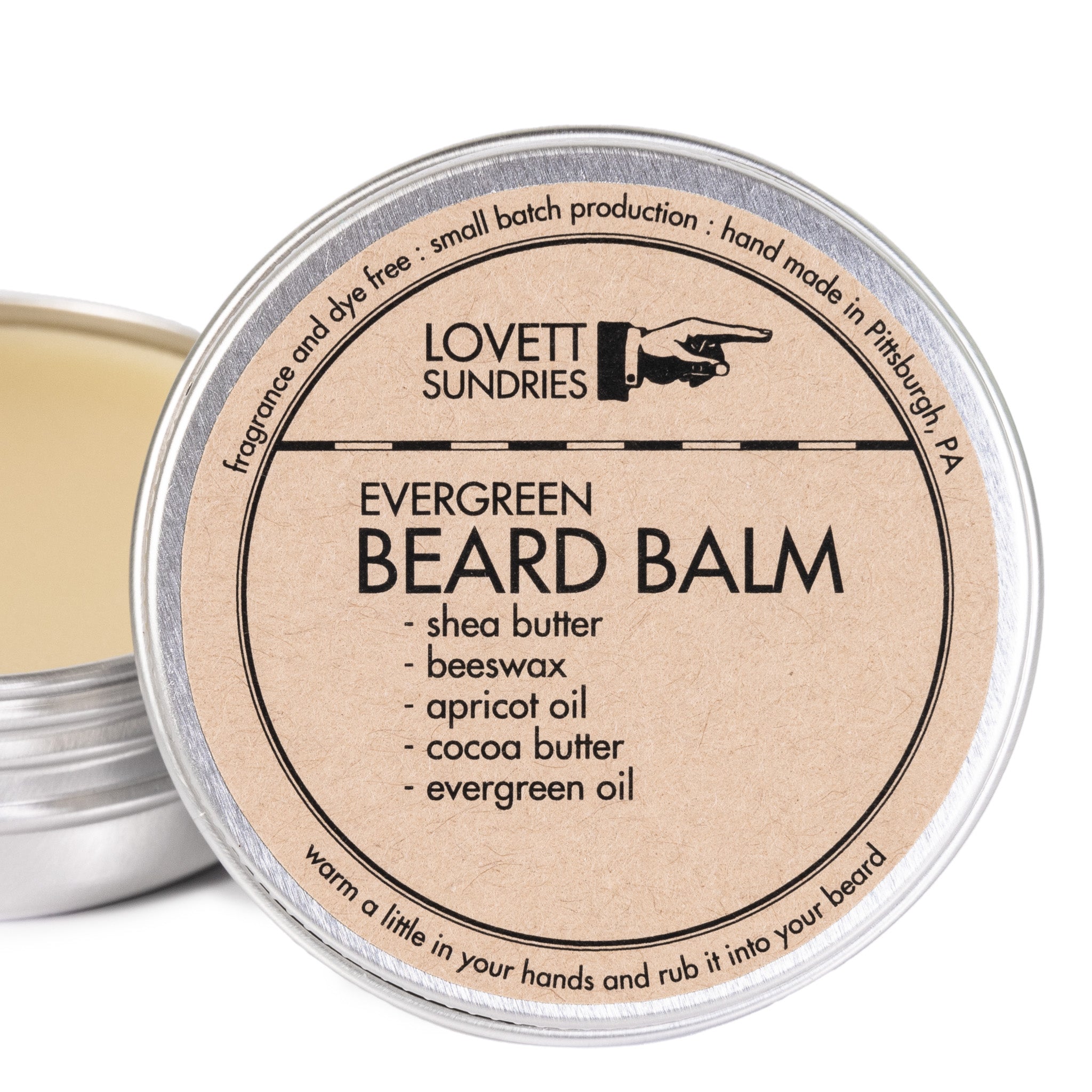A tin of evergreen-scented beard balm.