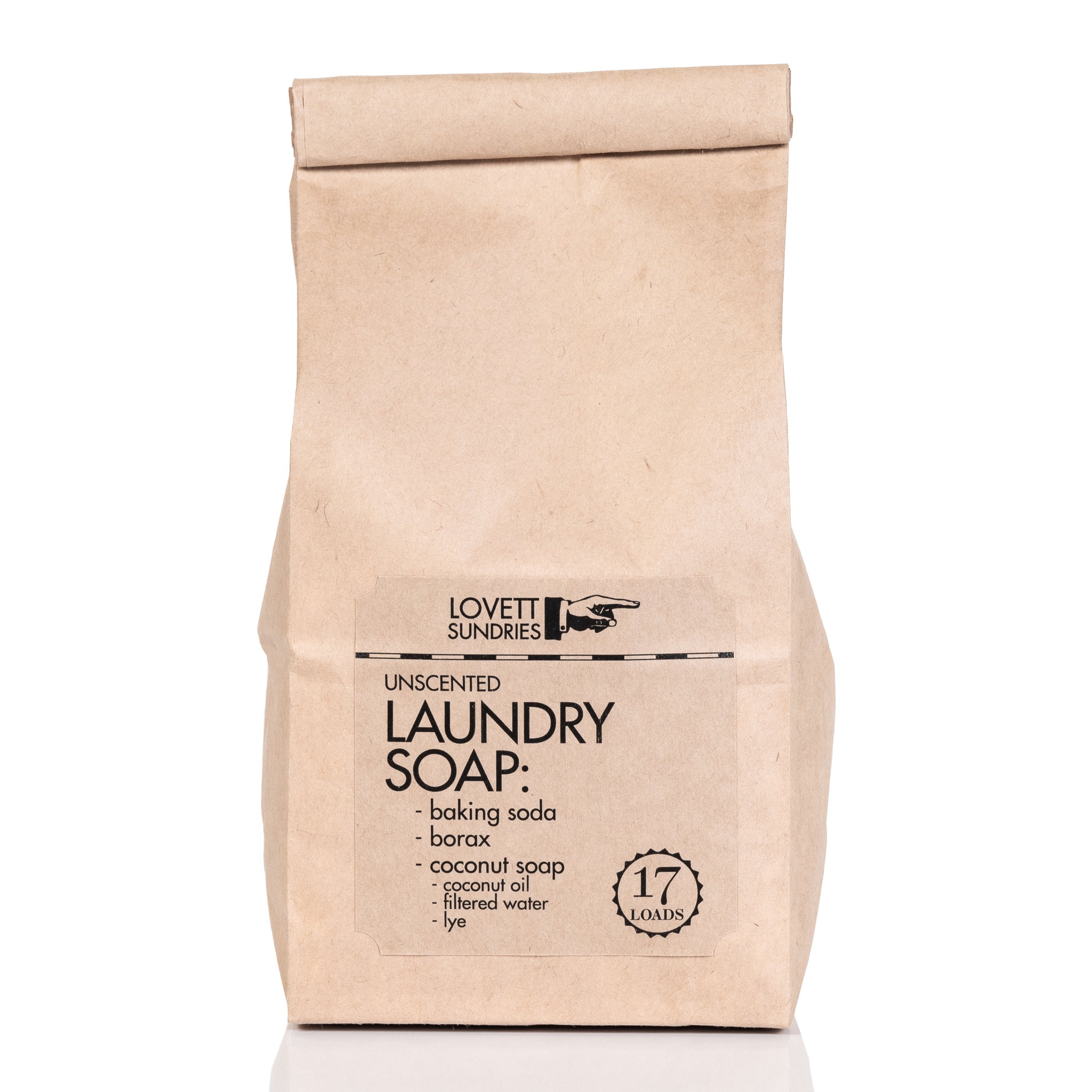 Natural laundry soap in brown bag on white background.