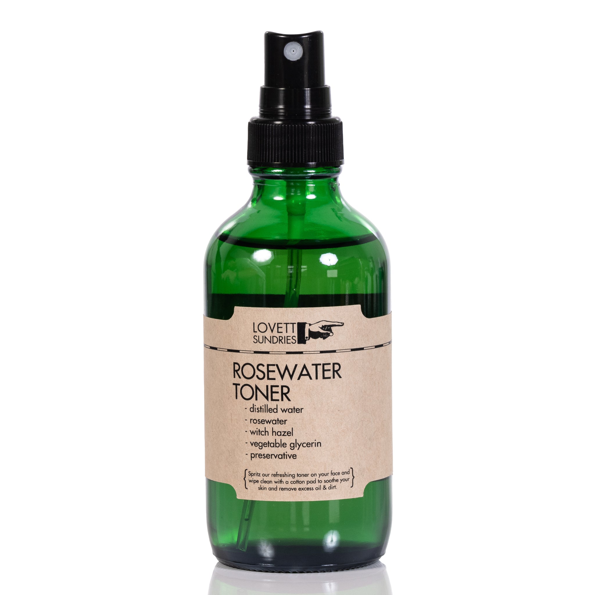 Glass bottle with mist sprayer and kraft paper label, contains rose-scented facial cleanser.