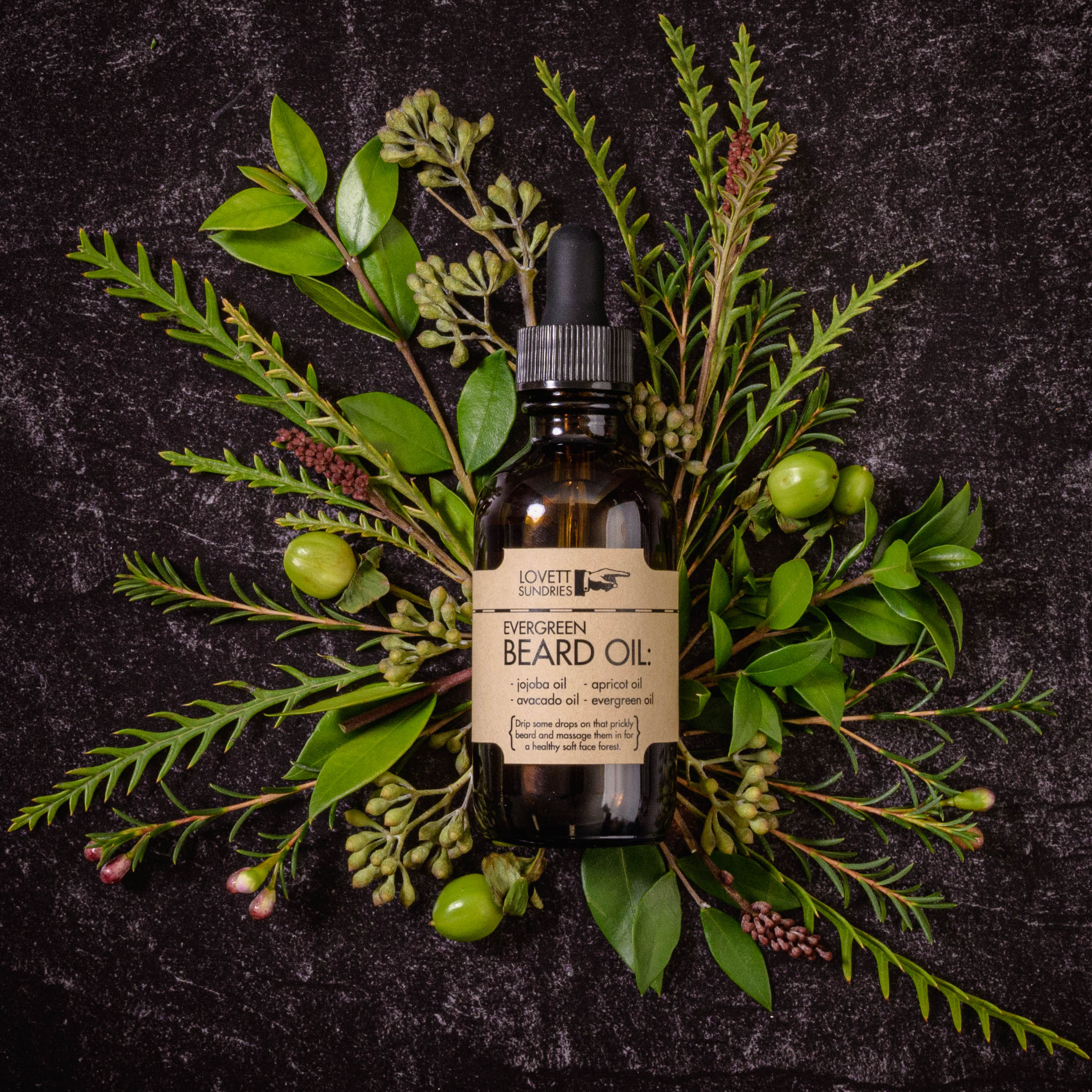 Bottle of Evergreen Beard Oil laying on a bed of refreshing flowers and botanicals.